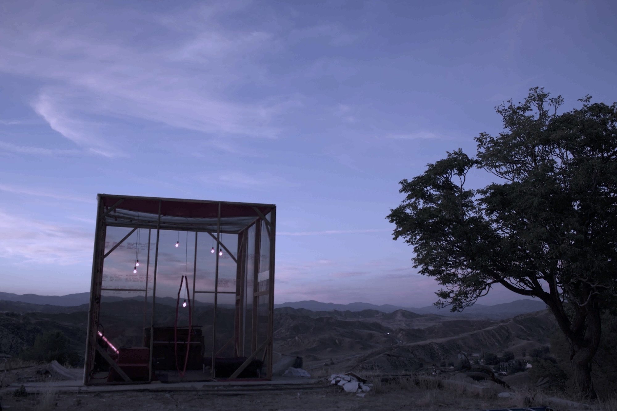 photo of the cube in the mountain at sunset